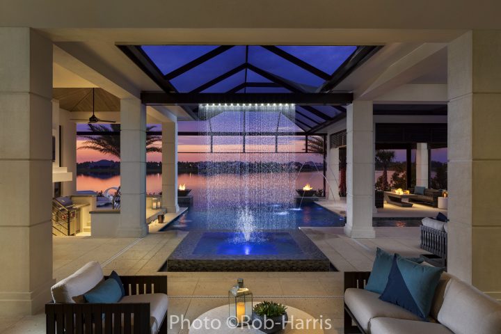 Inside of a beautiful home showing pool, decor, and furnishings in twilight