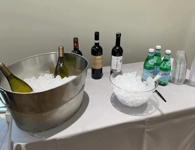 IMG-0972 Web Op NCS Party Planning Top 10 Tips Venice Florida cropped 1900×1460 Drinks and an ice bucket on a white clothed table provided by Nancy's Concierge Services Party Planning